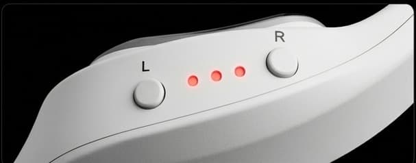 Left and right buttons with three indicator lights between them.